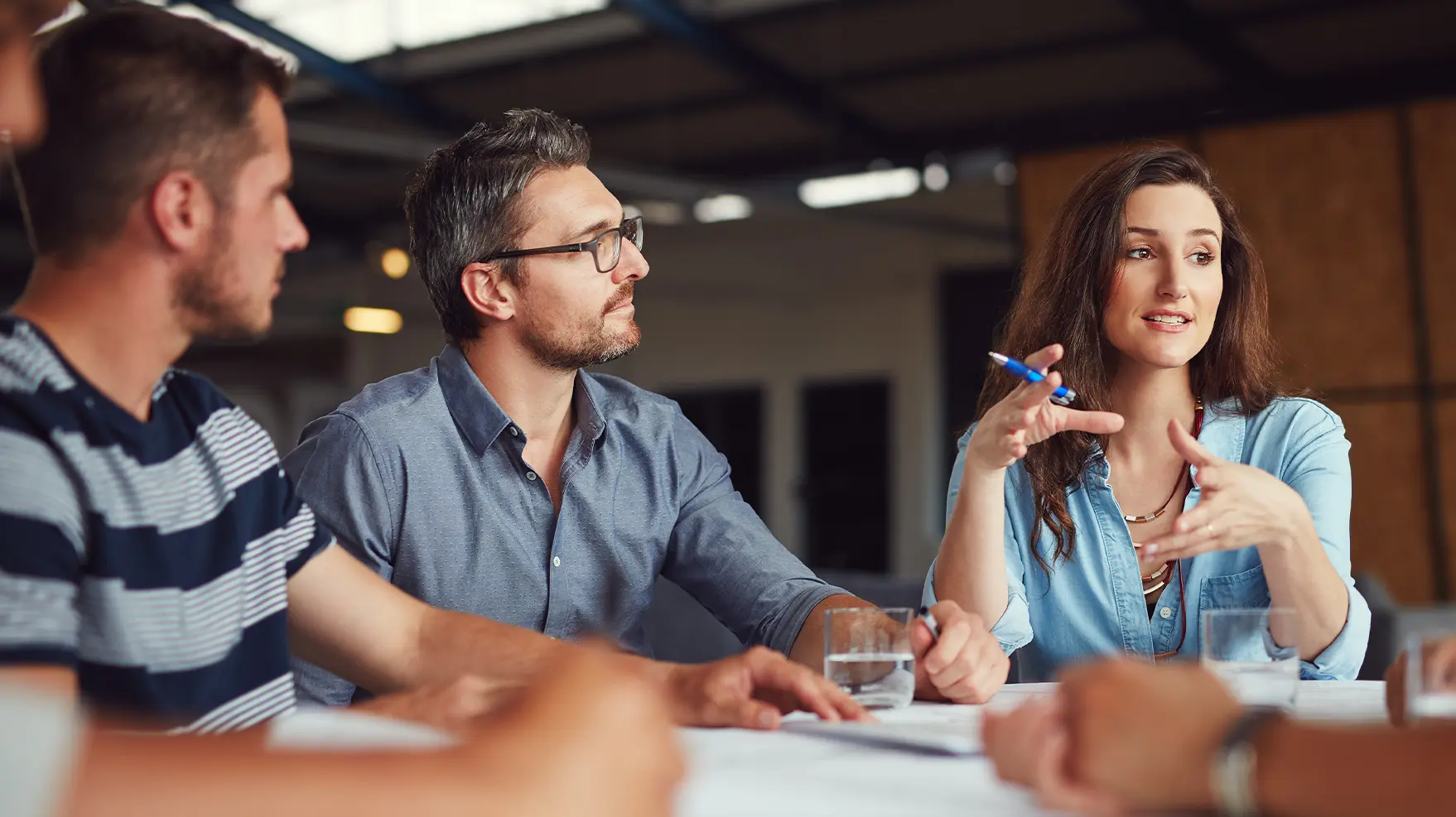 group of casually dressed business professionals in a meeting