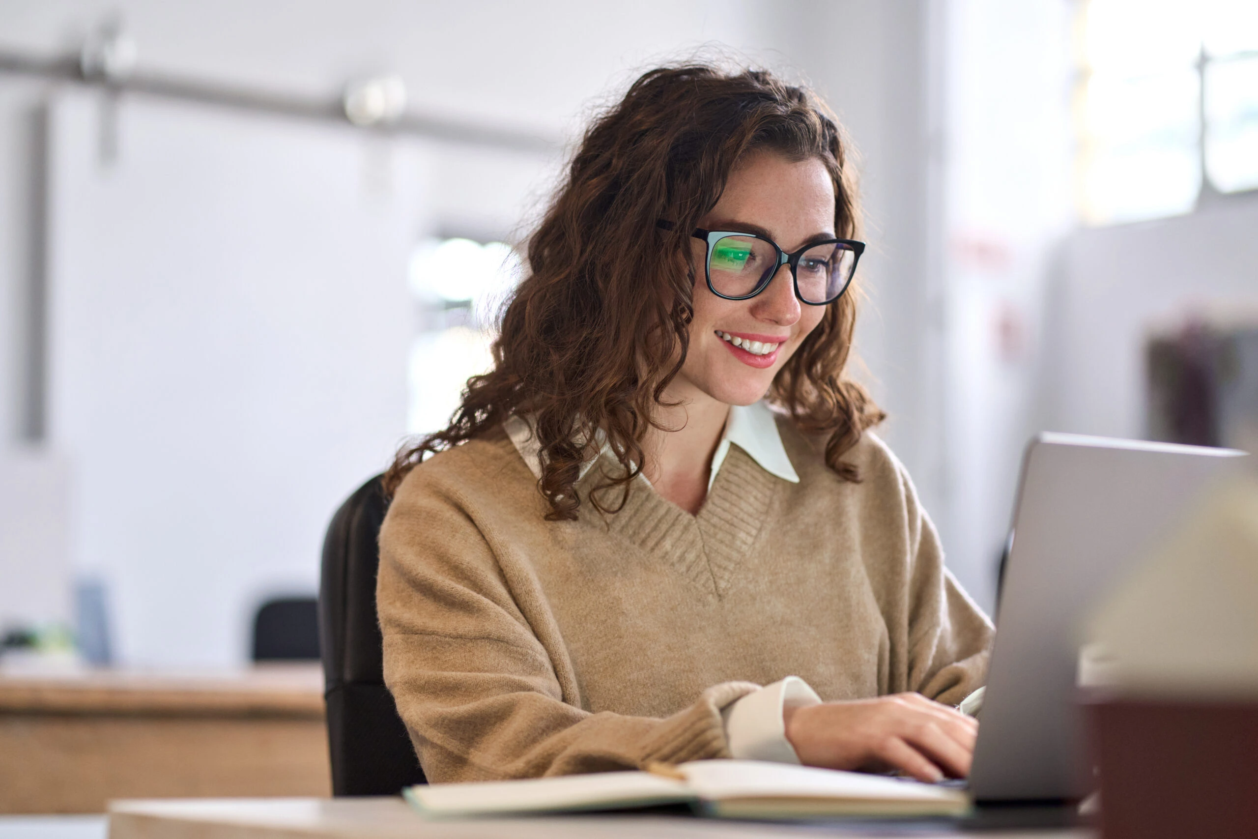 young woman working on a laptop