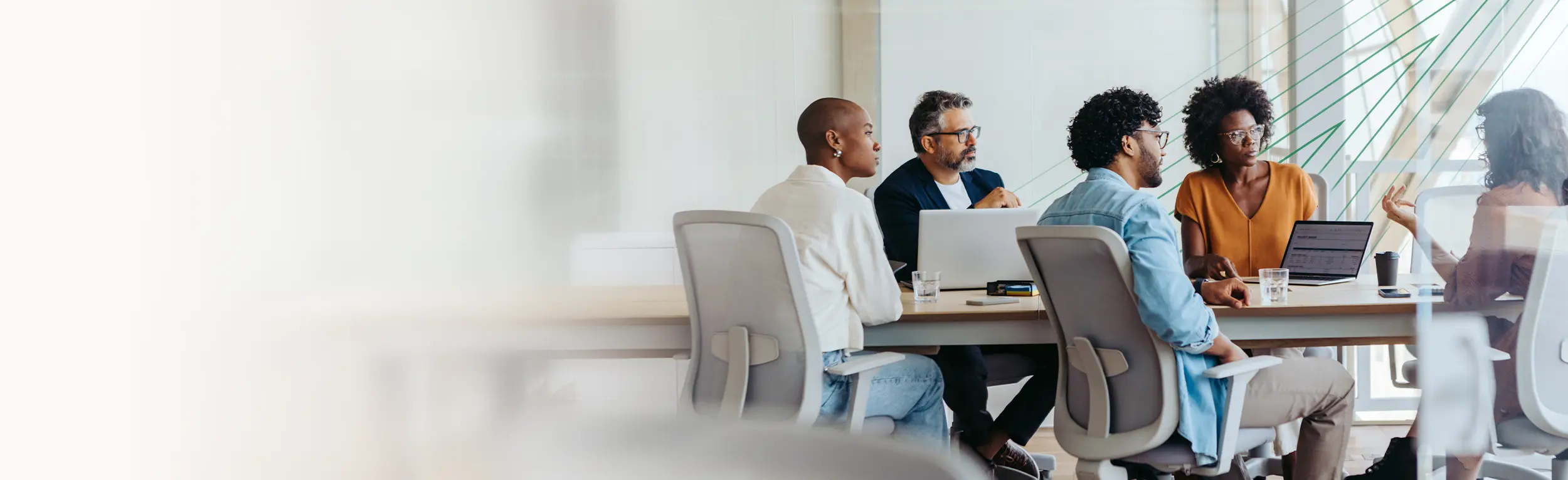 group of professionals gathered around a meeting table