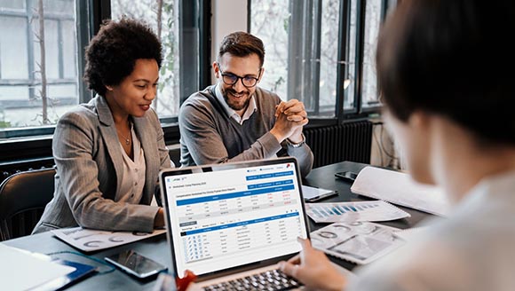 A group of multiracial businesspeople is sitting at the office a